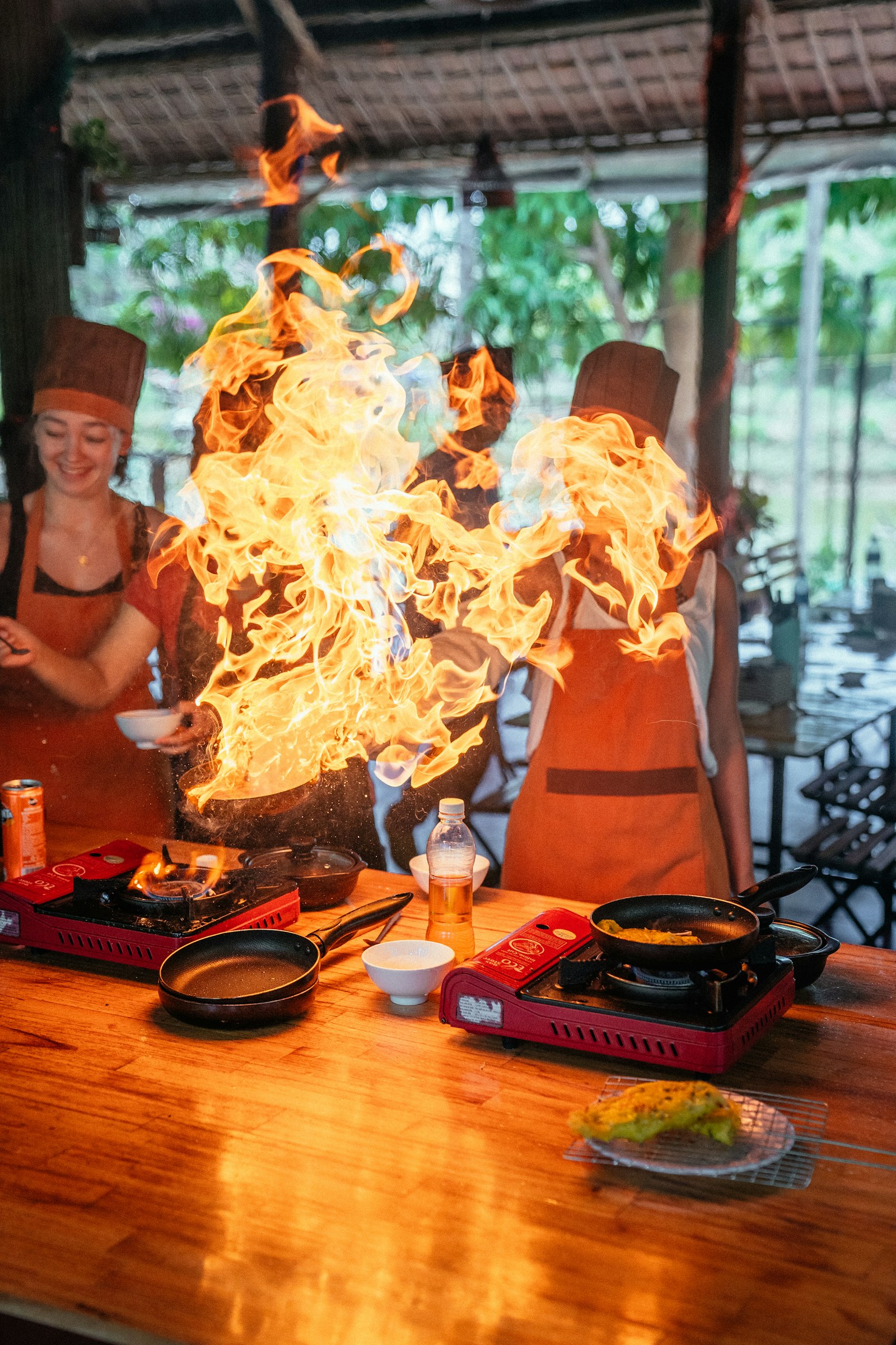 Travellers learning to cook a regional dish with a local chef